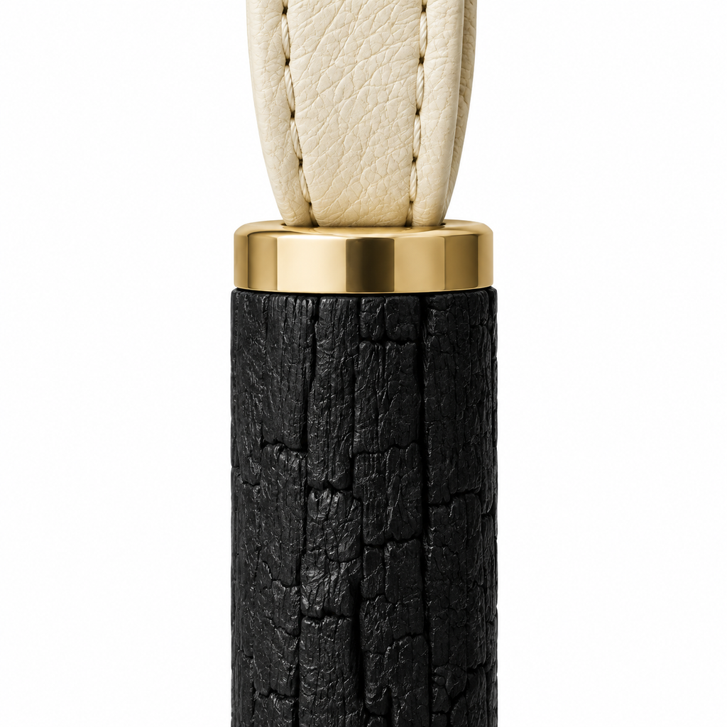 Charcoal keychain featuring durable materials and leather strap.