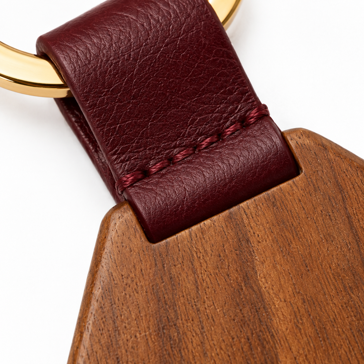 Stylish keychain with leather and gold accents.