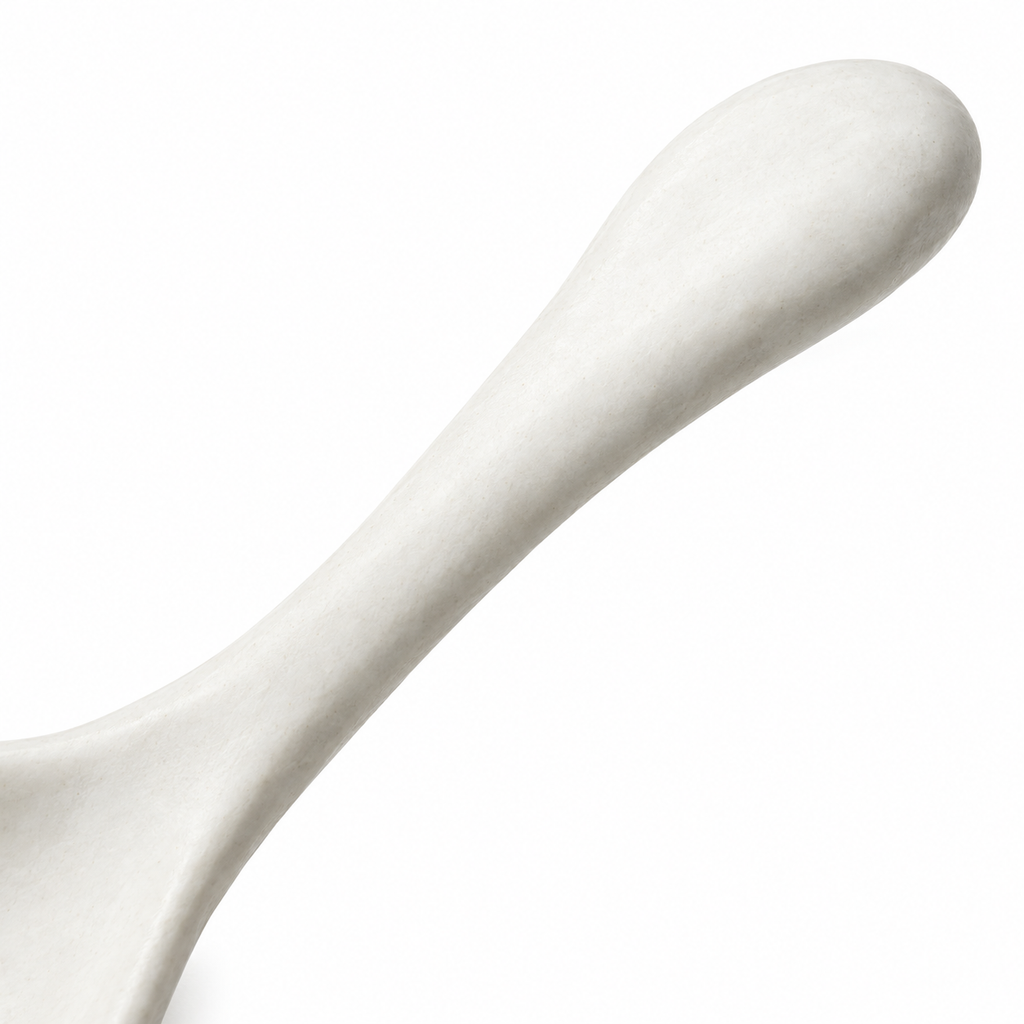 Top view of a white ceramic spoon