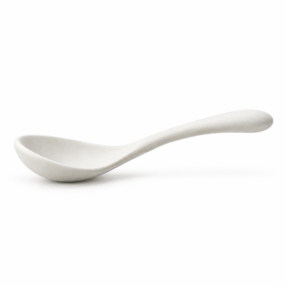 Close-up of the handle of a ceramic soup spoon