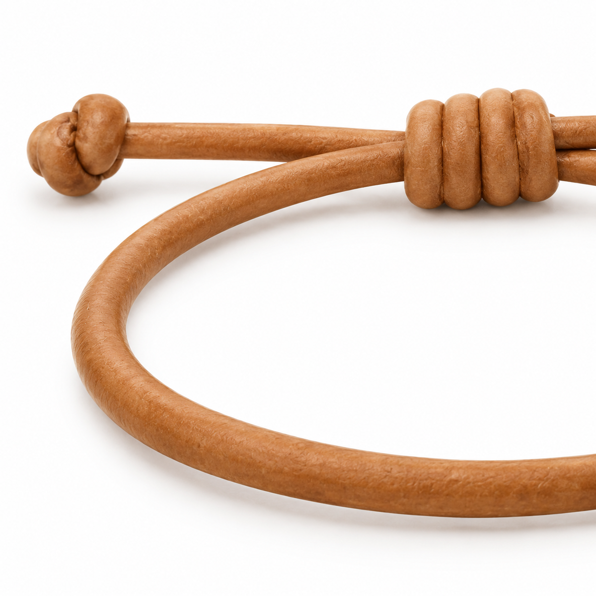 Elegant tan bracelet with knot design