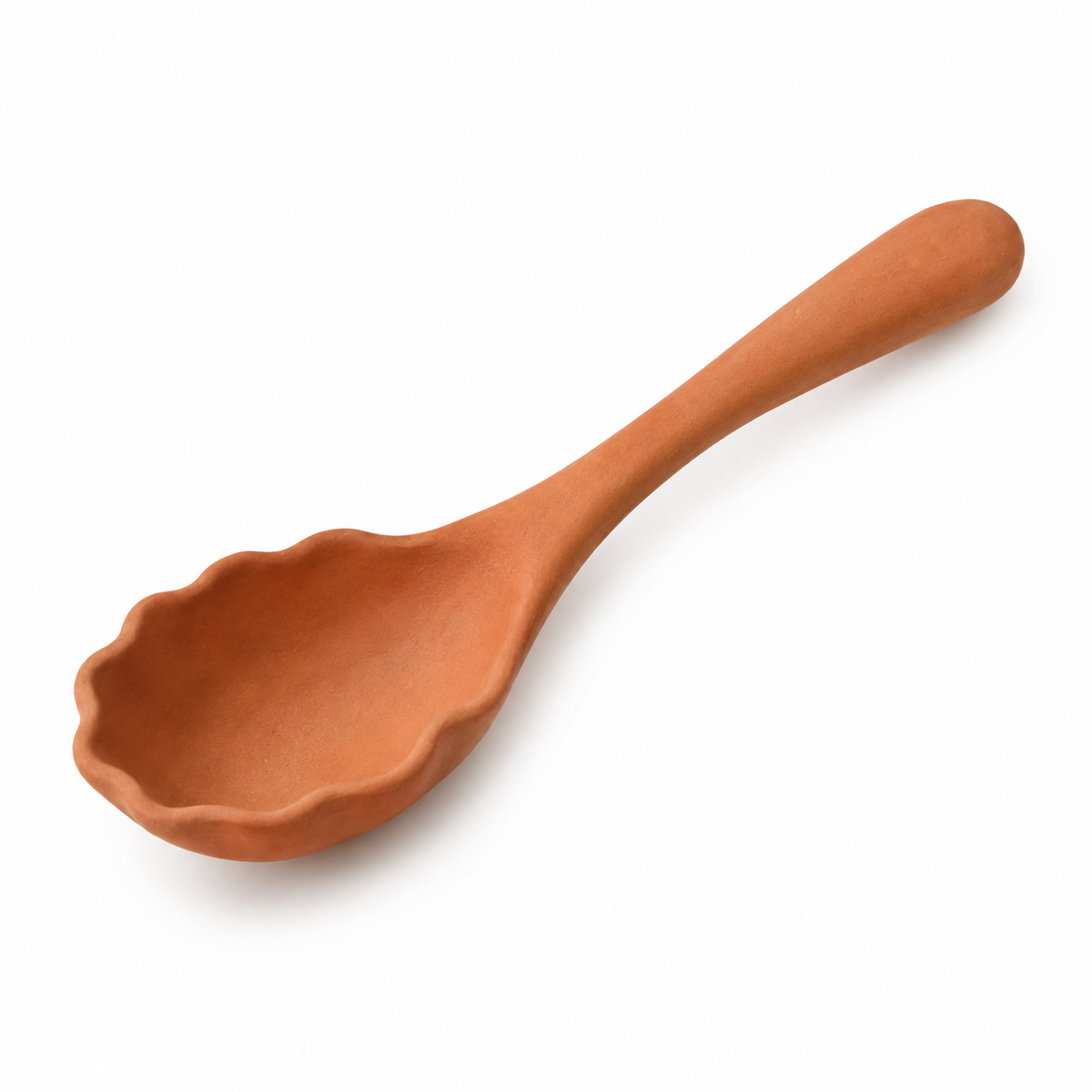 Handmade terracotta serving spoon with scalloped design