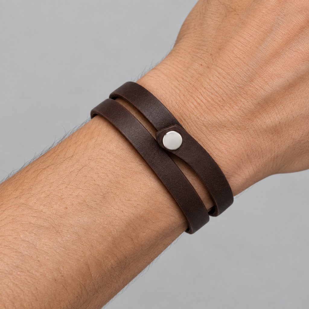 Close-up of the leather bracelet's snap closure.