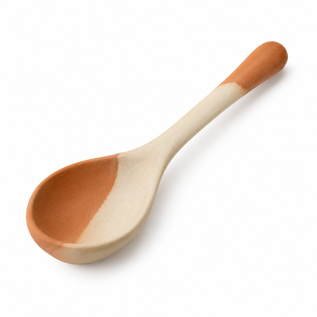 Handmade ceramic spoon with dual-tone design.