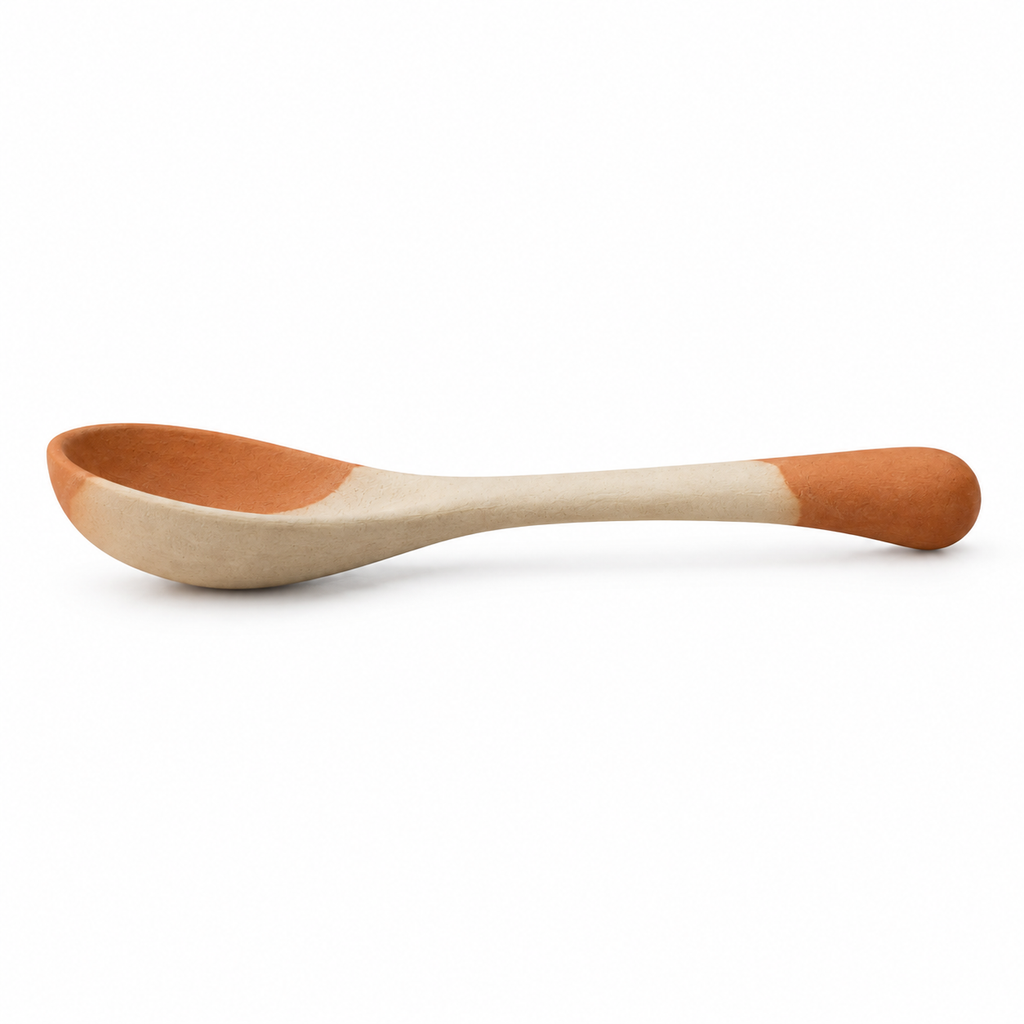 Side view of ergonomic handle on ceramic spoon.