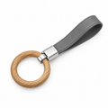 Stylish leather and wood keychain with metal accents.