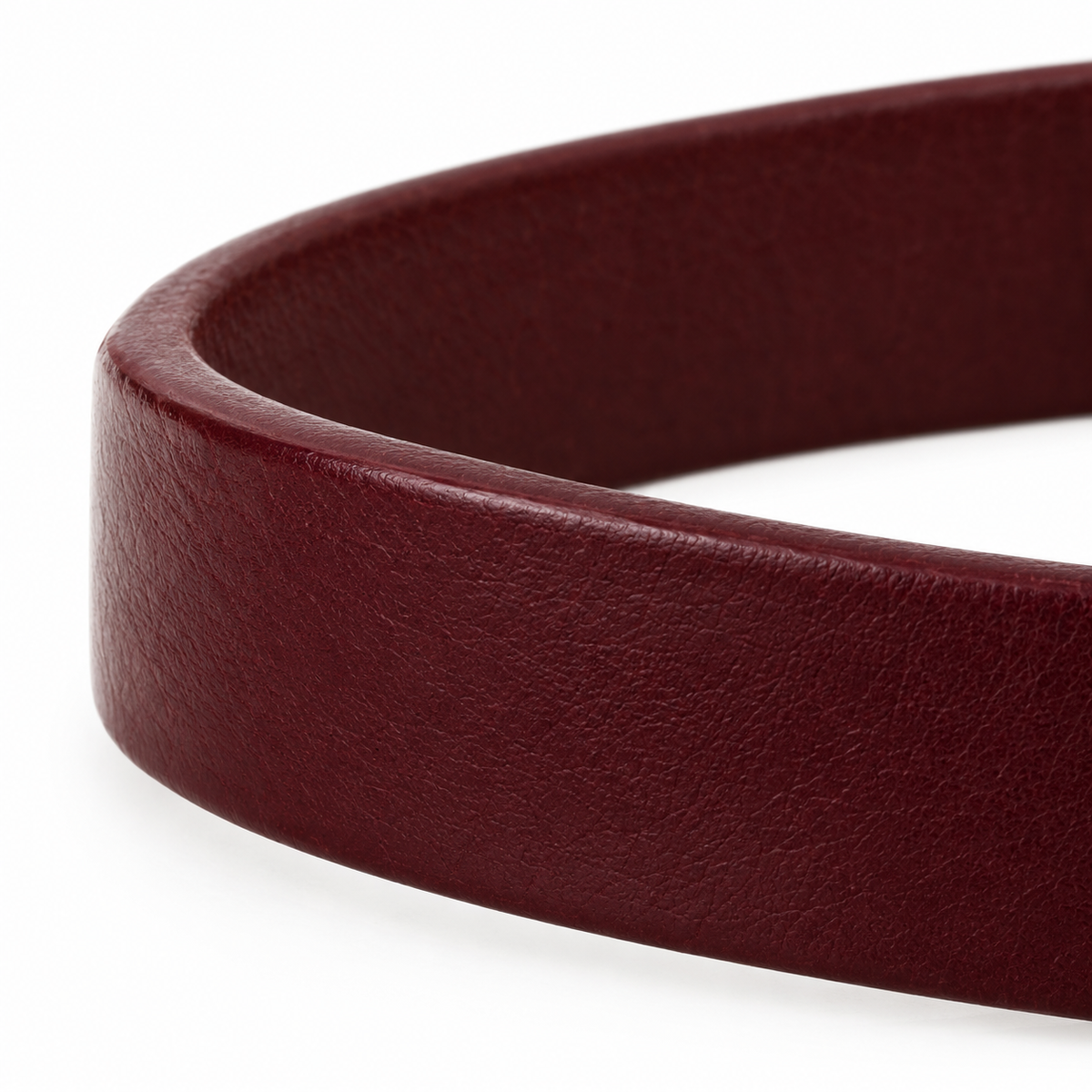 Gold-tone keeper loop and stitched edge detail