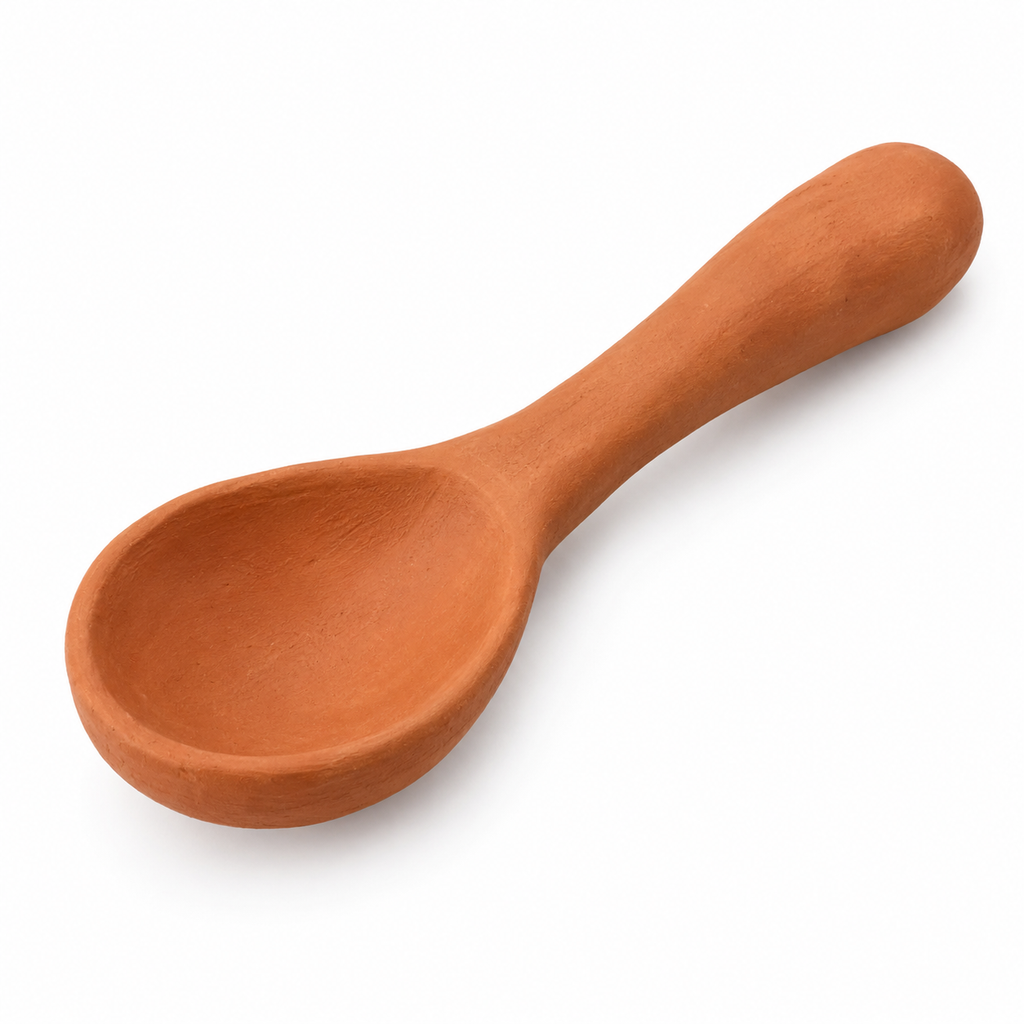 Handmade terracotta serving spoon with natural finish
