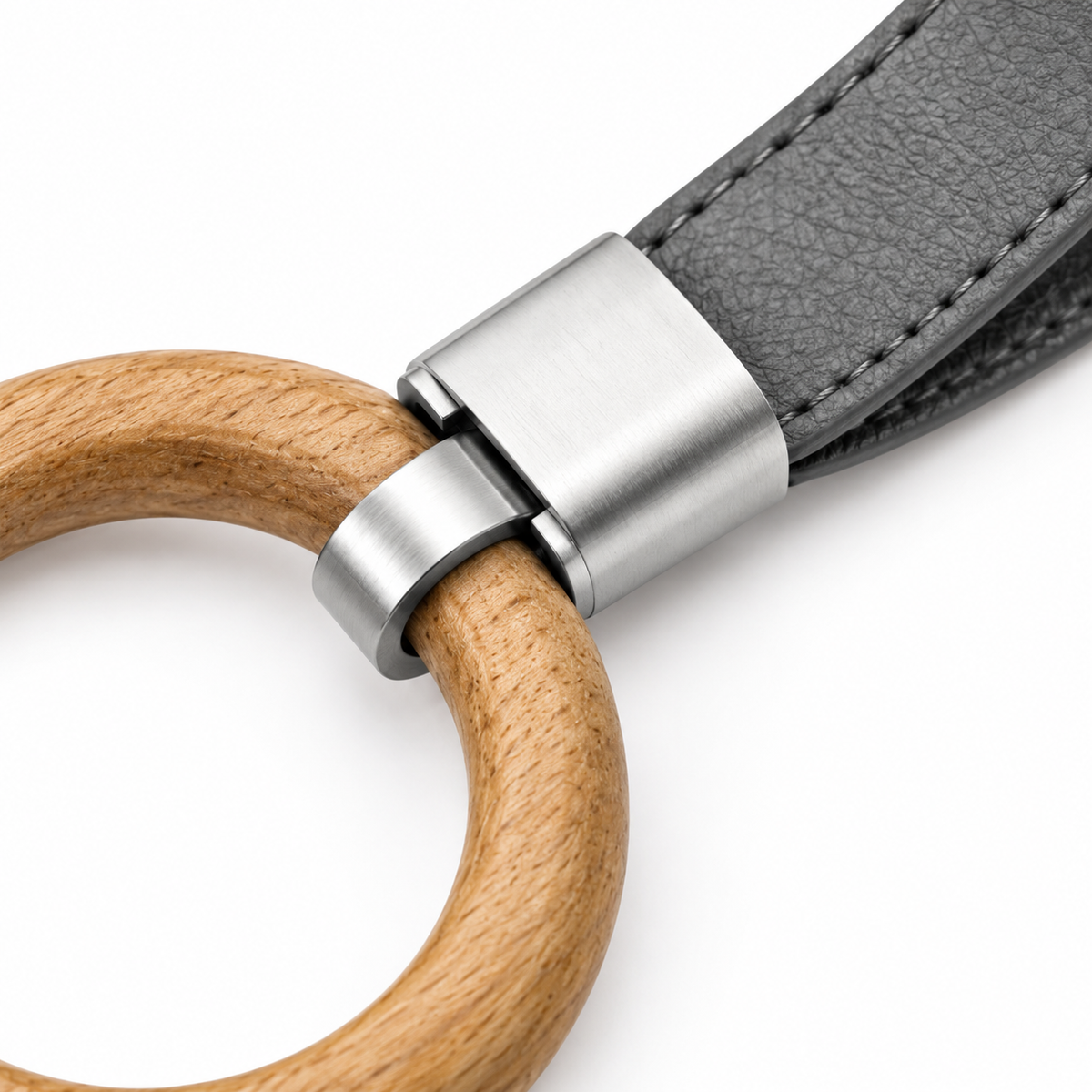 Elegant keychain with grey leather and natural wood.