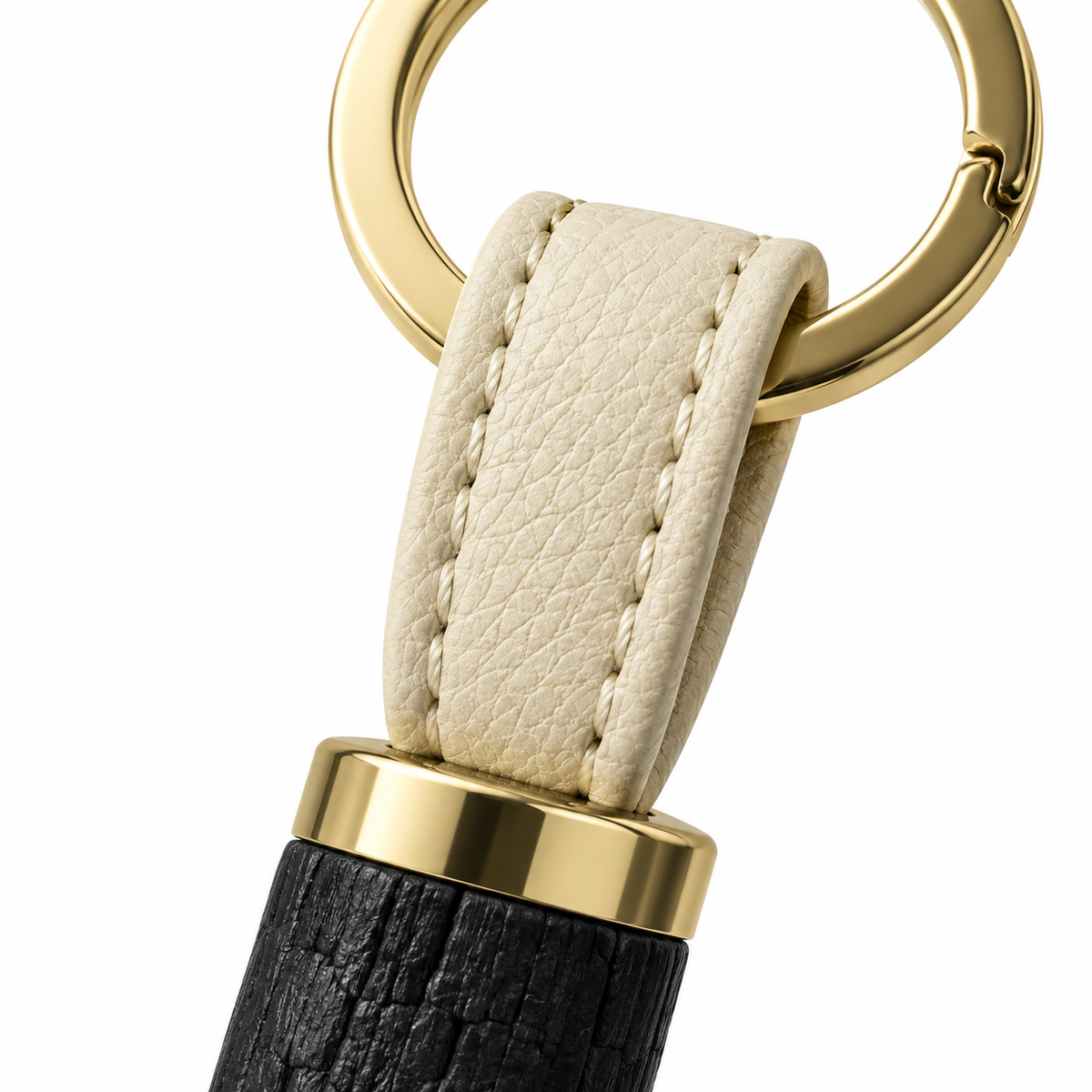 Compact and stylish charcoal keychain with gold ring.
