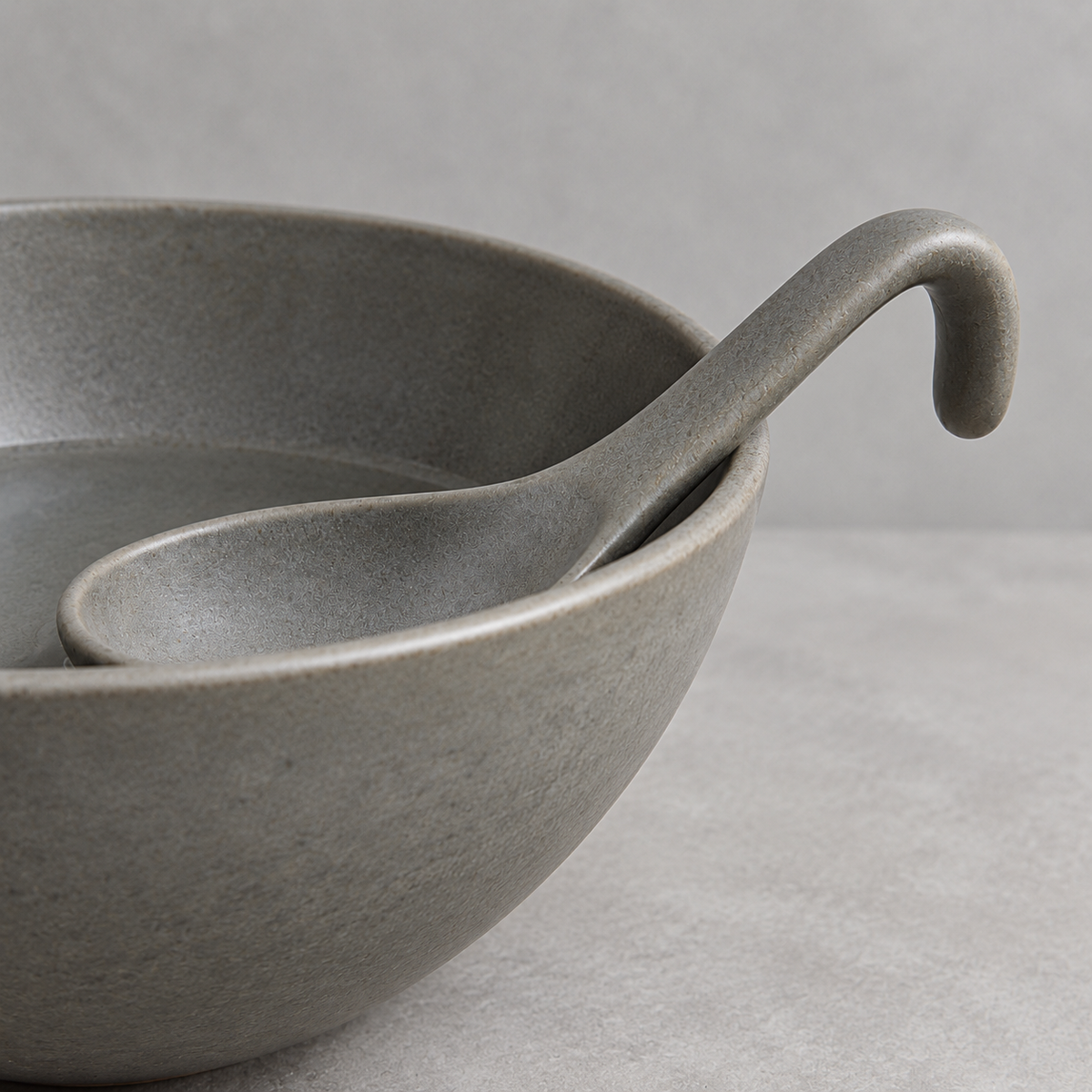 Side view of gray ceramic spoon