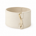 Front view of cream leather cuff bracelet with gold hook.