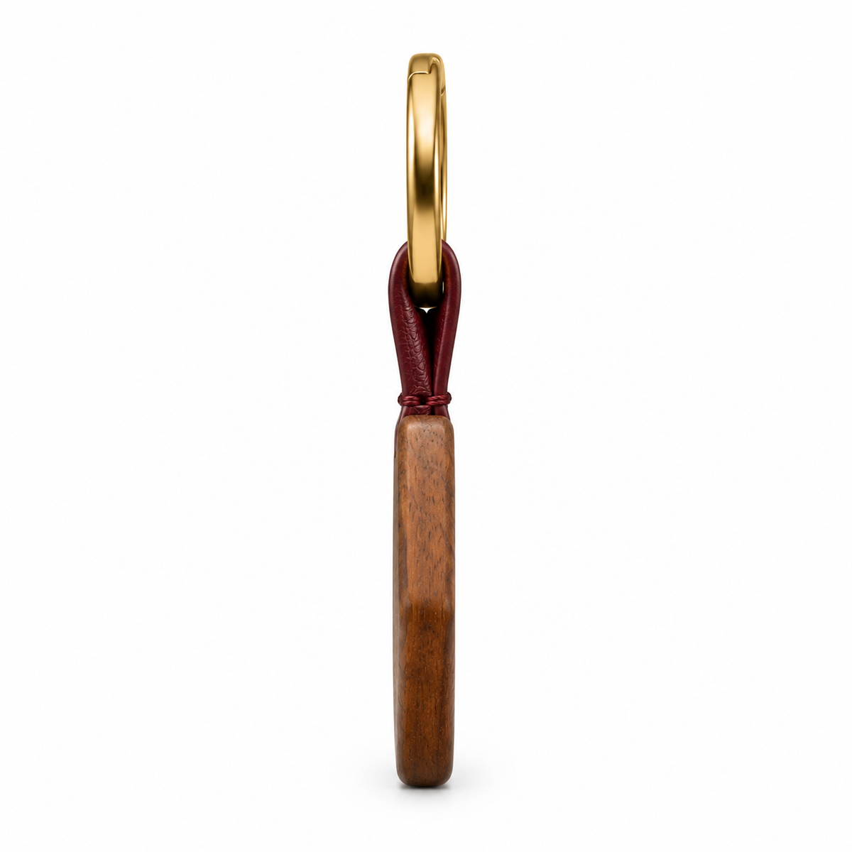 Keychain showing leather strap and gold ring.