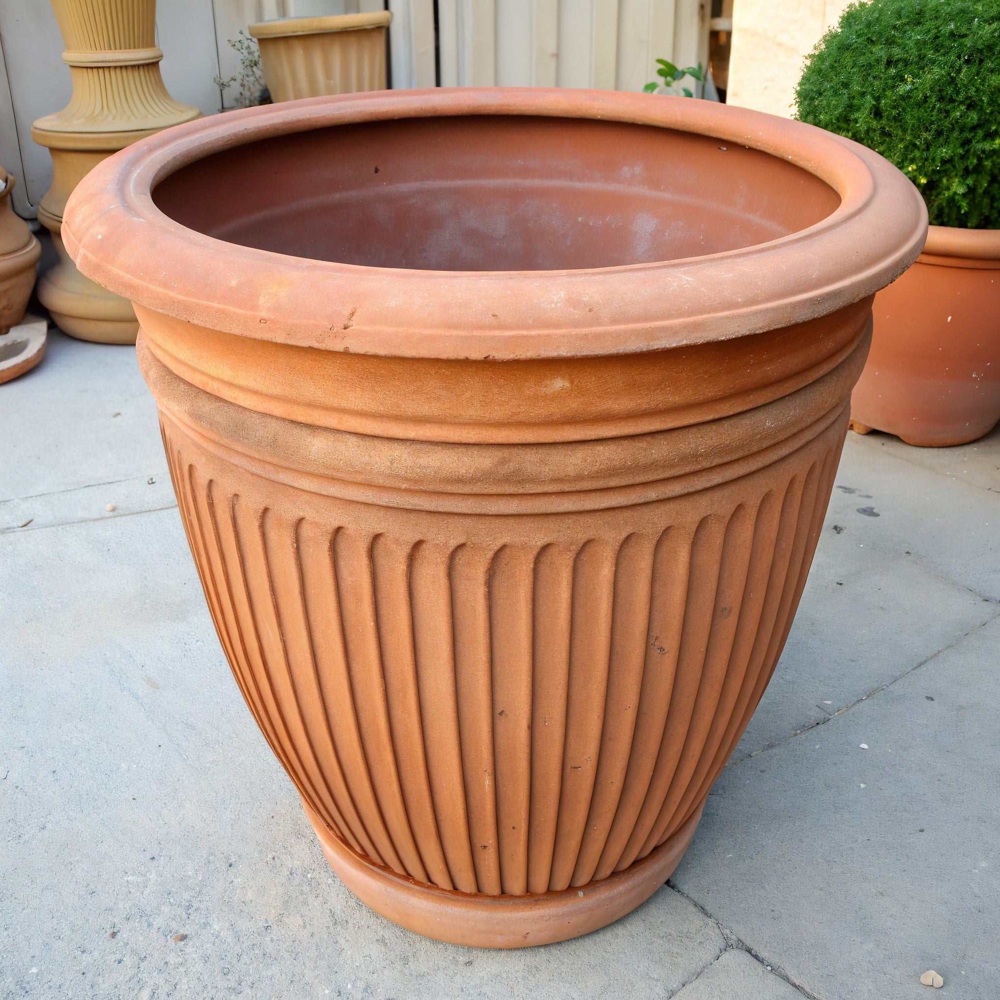 Vensioshop Ribbed Terracotta Planter — three-quarter front view showing ribbed design and rustic finish