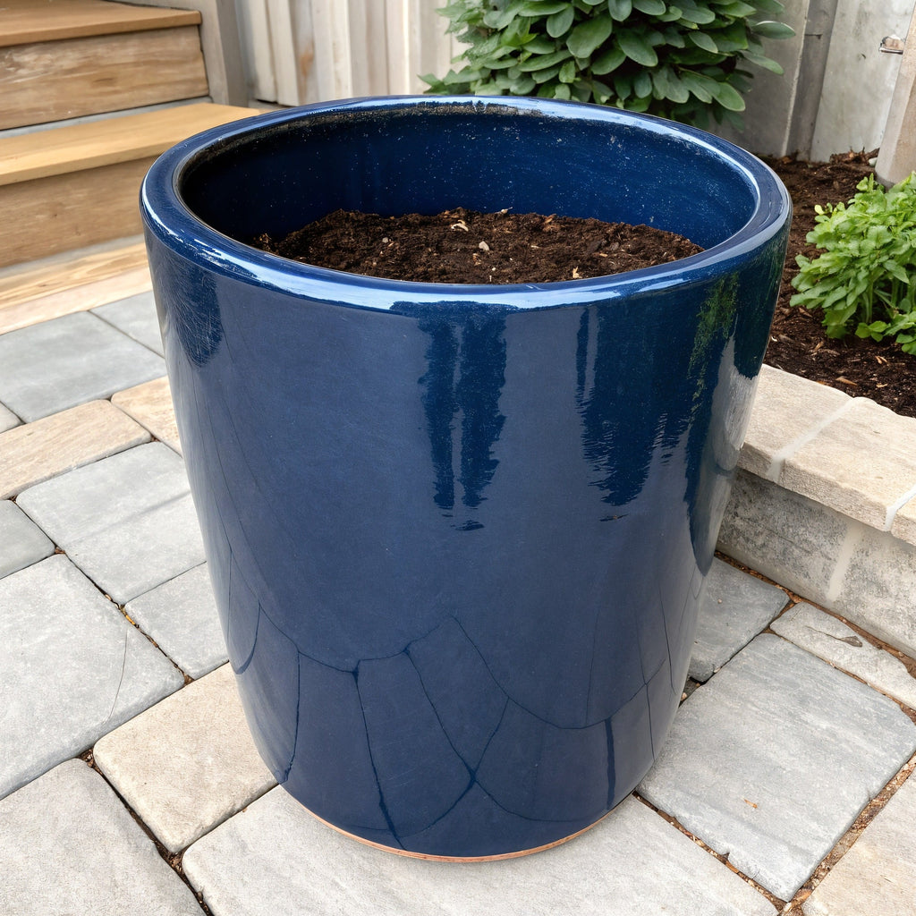Vensioshop Midnight Blue Cylinder Ceramic Planter — three-quarter front view showing its glossy finish and cylindrical shape