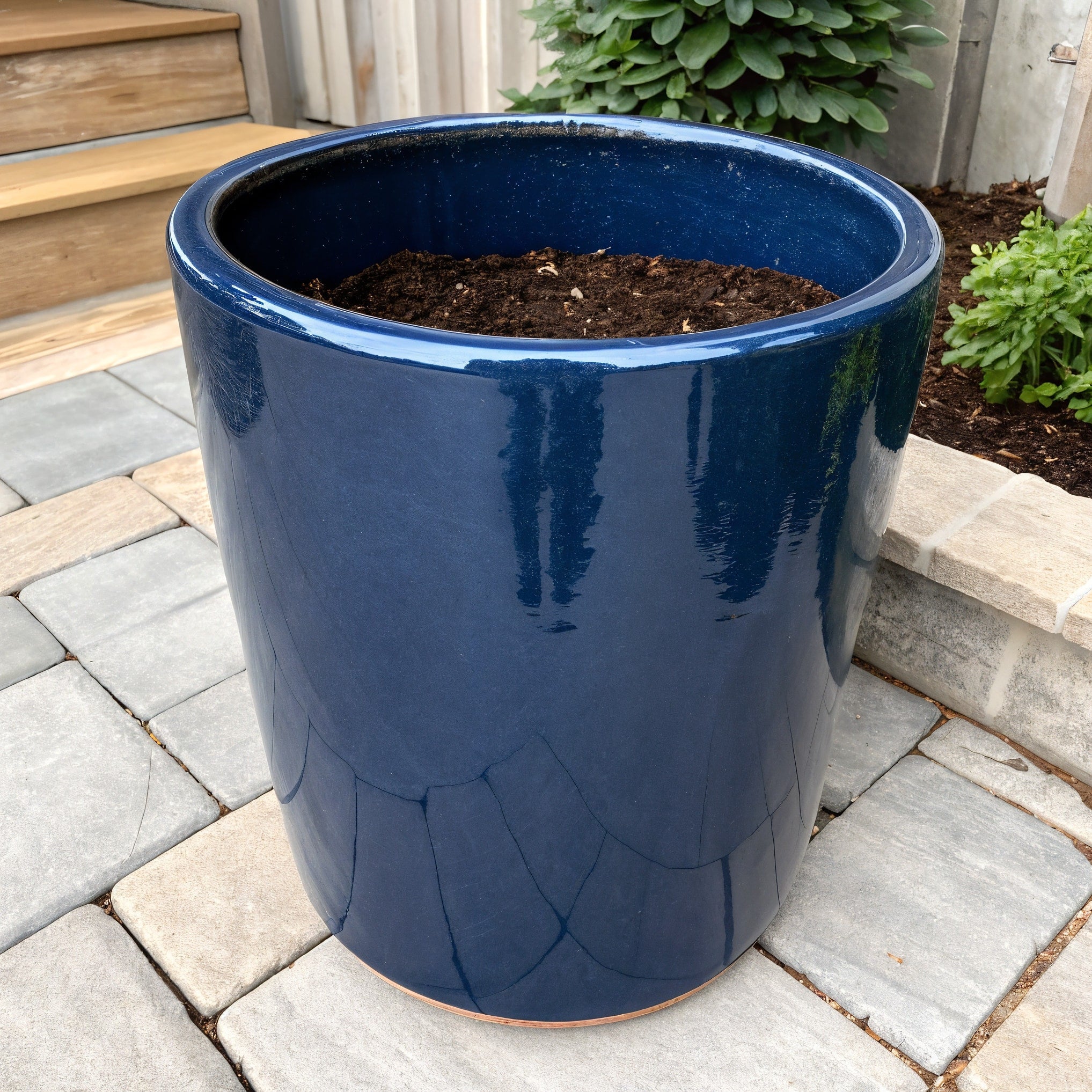 Vensioshop Midnight Blue Cylinder Ceramic Planter — three-quarter front view showing its glossy finish and cylindrical shape