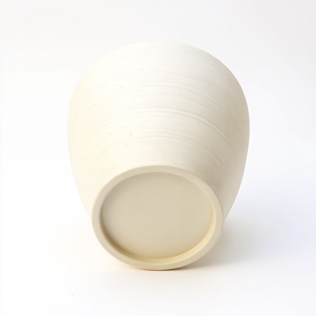 Vensioshop Ivory Ceramic Planter — underside view showing base and drainage hole