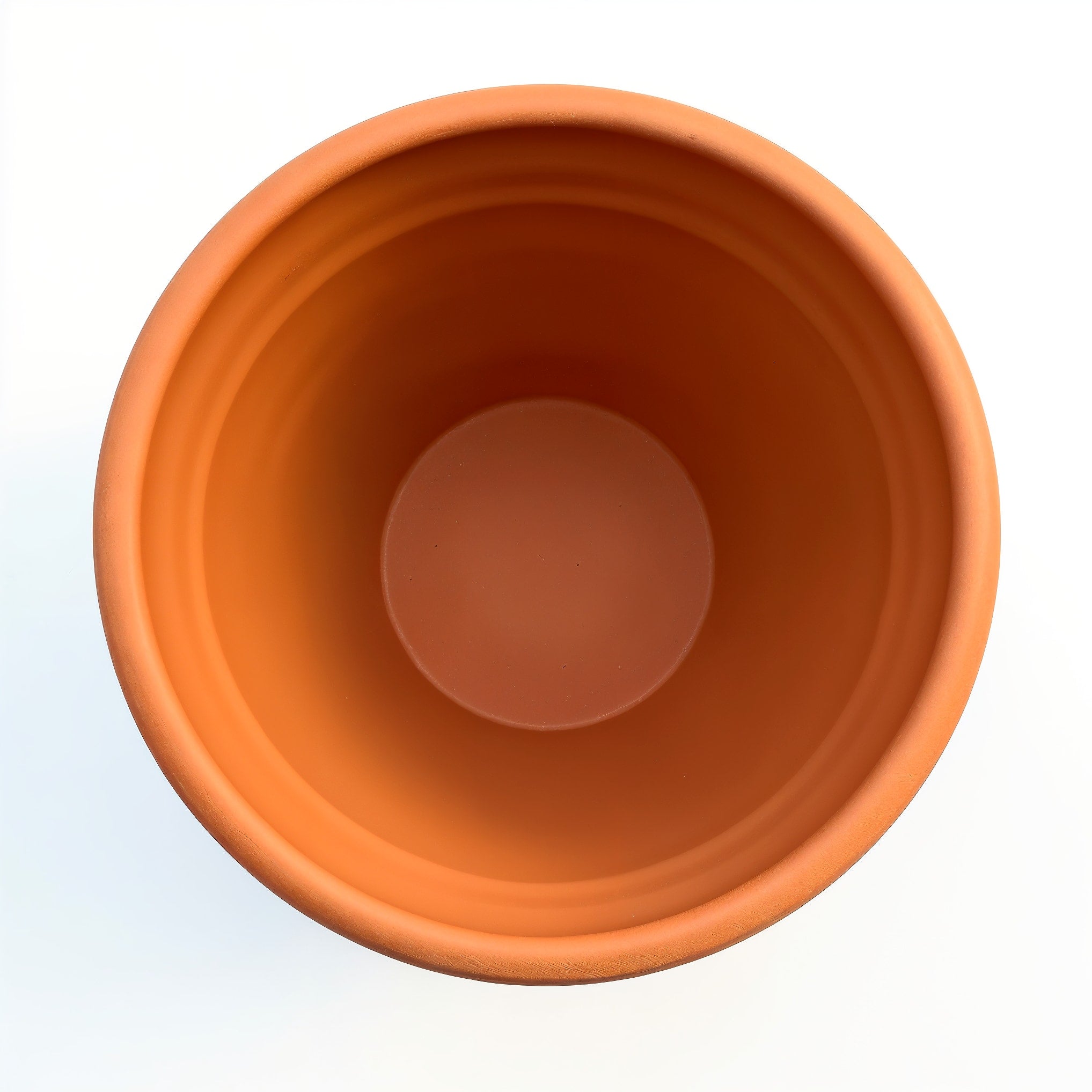 Vensioshop Large Smooth Terracotta Planter — top-down view into the planter's opening, showing the interior.