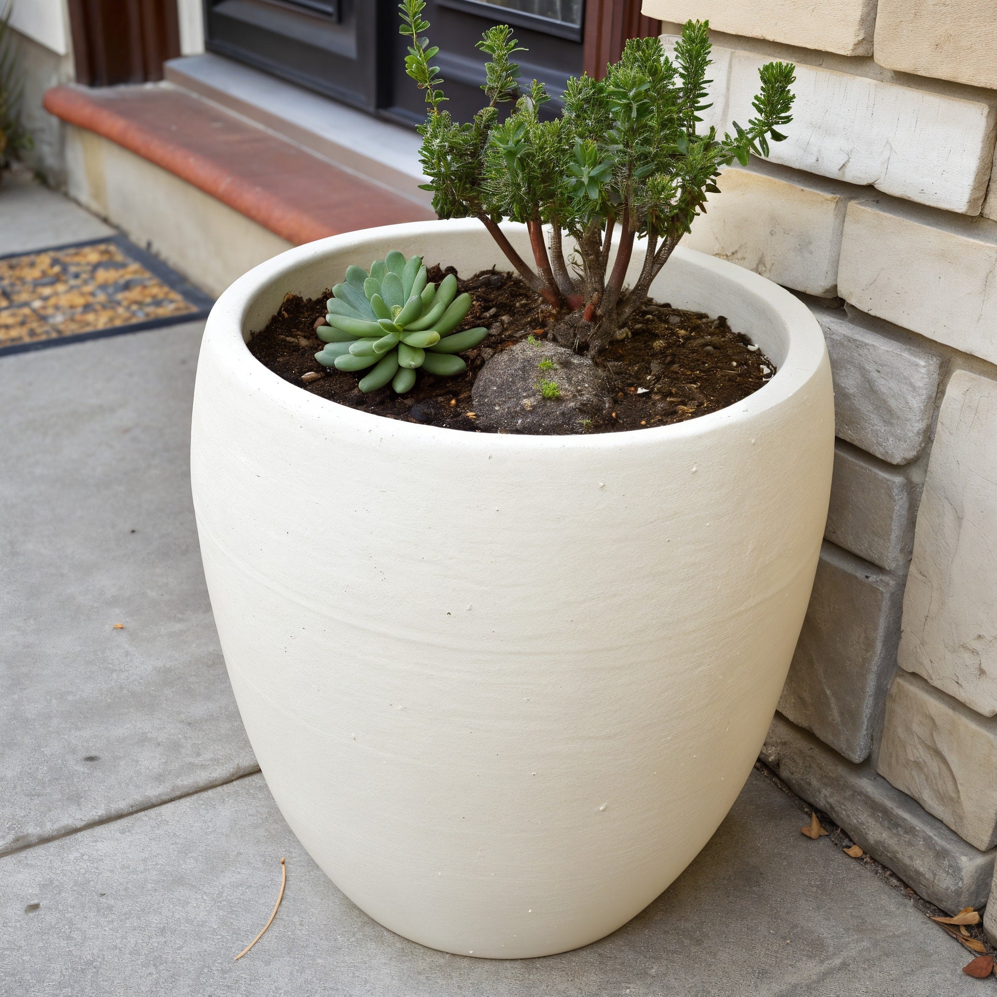 Vensioshop Ivory Ceramic Planter — three-quarter front view showing the planter's silhouette and opening